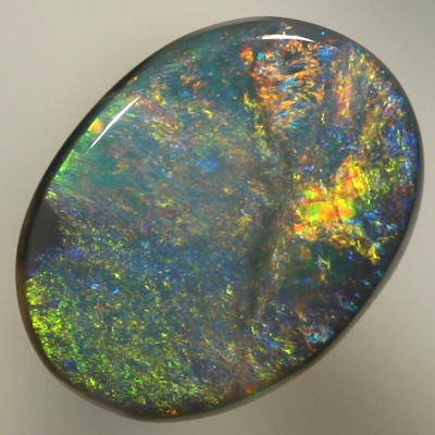 SOLID BLACK OPAL Golden red orange contrasted by turquoise blue. SEE VIDEO